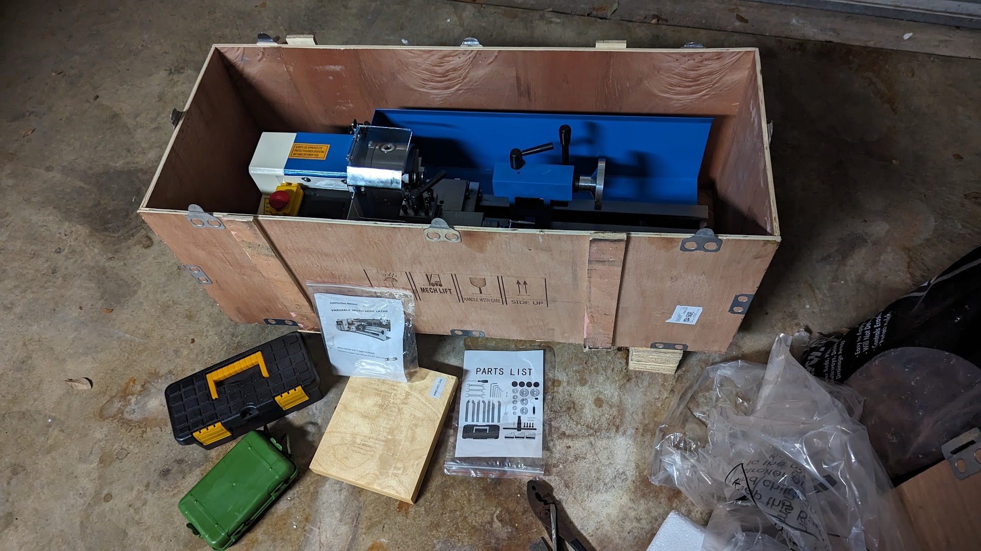 An opened box of a Vevor mini lathe.